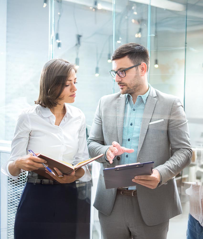 A man and woman in conversation at office