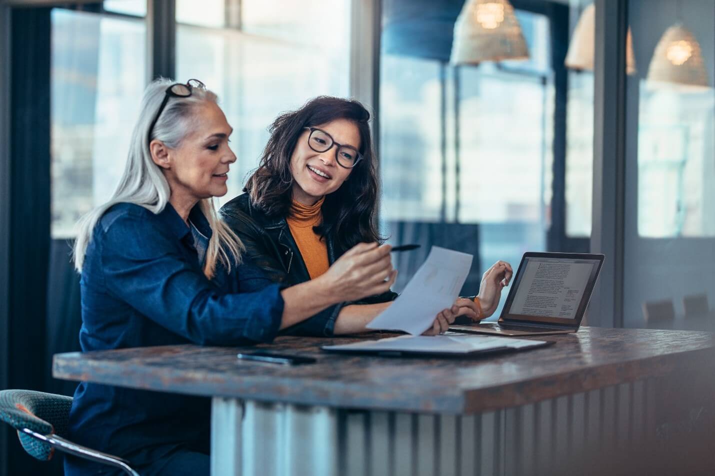 two women discussing information